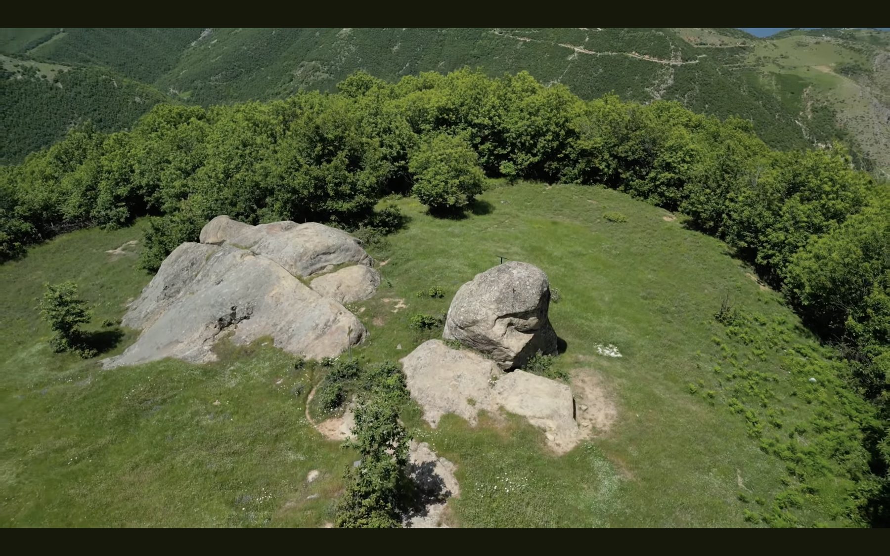 Aerial view of the grassy clearing and rock formations on the Kabash Trail